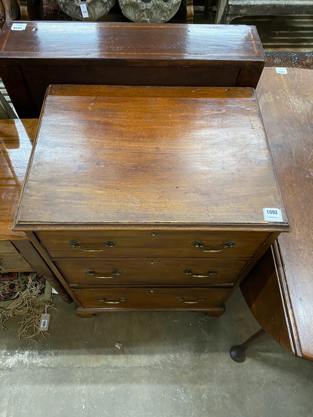 A George III style mahogany chest of three drawers, width 63cm